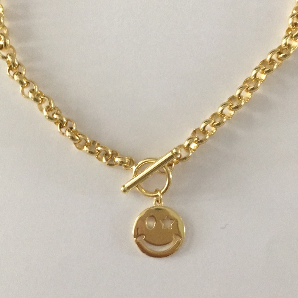 Gold rolo chain with smiley face charm.